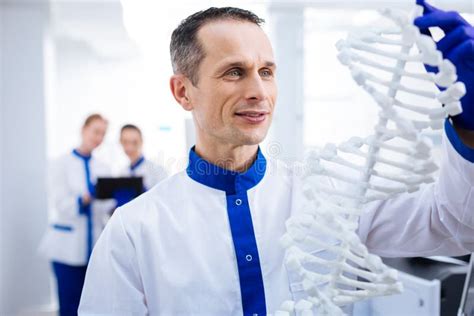 Fascinated Contented Scientist Conducting Dna Testing Stock Photo