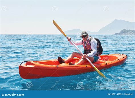 Boat Kayaking Near Cliffs On A Sunny Day Travel Sports Concept Stock
