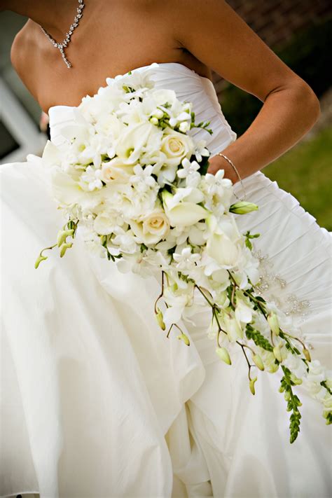 Cascading Style Bouquet With Calla Lilies Dendrobium Orchids Roses