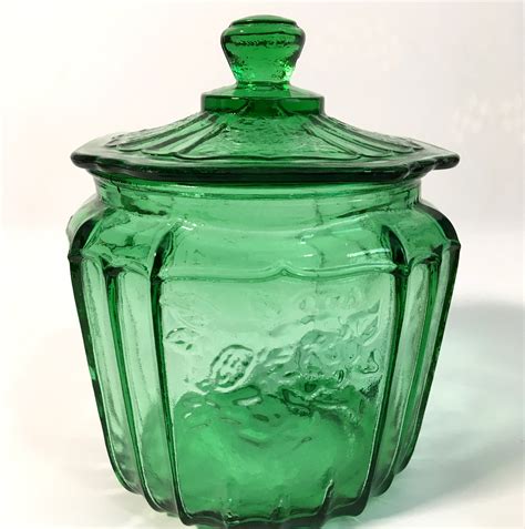 vintage green glass cookie or biscuit jar anchor hocking emerald green cooke jar w lid open