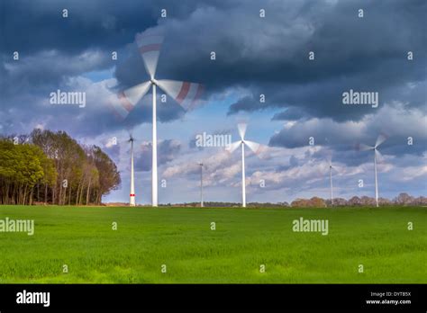 Moving Windmill Powerplants On A Green Meadow Stock Photo Alamy