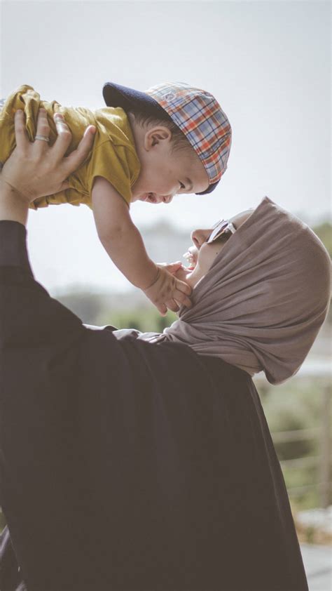 Download Mom And Son With Hijab Wallpaper