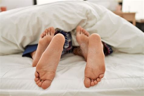 Couple Feet Under Sheets On The Bed At Home Stock Image Image Of Bedsheet Covering 224046797