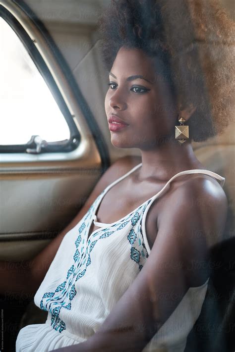 Portrait Of Beautiful African Woman Sitting Inside Of The Car By