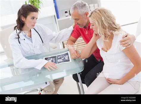 Doctor And Nervous Patient Examining Ultrasound Stock Photo Alamy