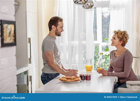 Cheerful Husband And Wife Relaxing In Kitchen Stock Image Image Of Beverage Healthy 89837009