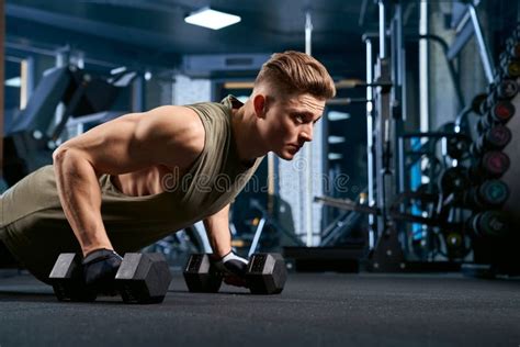 Muscular Man Doing Push Ups Using Dumbbells Stock Image Image Of