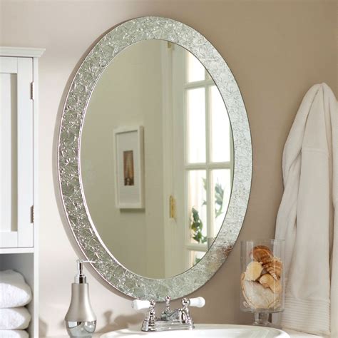 The perfect size for a bathroom vanity mirror, this oval wall mirror has simple, smooth lines from the thin black frame enveloping the mirror inlay. Oval Frame-less Bathroom Vanity Wall Mirror with Elegant ...