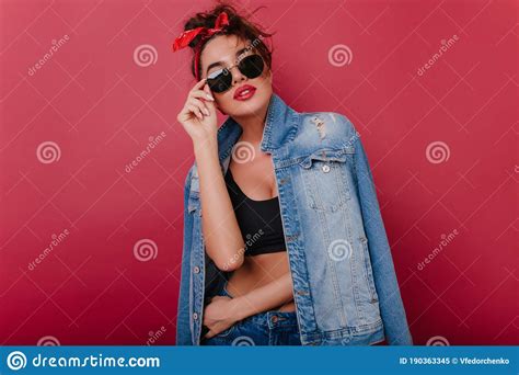 Joyful Sensual Woman In Black Tank Top Posing With Interest Indoor