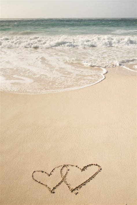 Caribbean Barbados Silver Sands Beach Two Hearts In The Sand Stock Photo