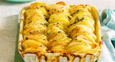 Place a baking sheet on a high shelf to heat while you parboil the potatoes · drop the potatoes in salted boiling water and . Vertical potato bake Recipe | Better Homes and Gardens