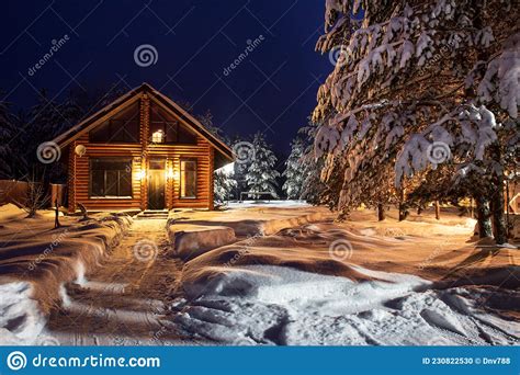 A Path Among The Snowdrifts Leading To A Rustic Log House A Winter