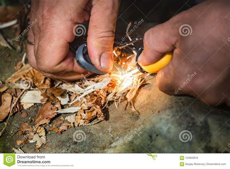 Man Striking Fire With The Flint And Steel Stock Photo - Image of flame, hand: 124840916