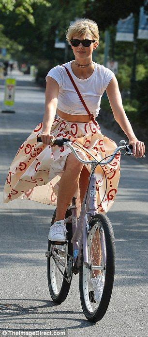 Karlie Kloss Wears A Tea Length Skirt As She Enjoys A Bike Ride In New York Bike Riding Outfit