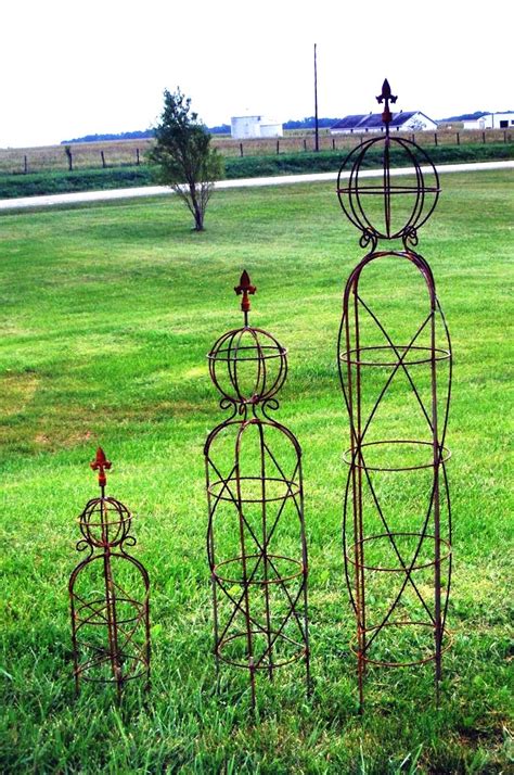 A plant trellis can add so much charm and functionality. Mystic 26" Small Sphere Garden Obelisk - Topiary