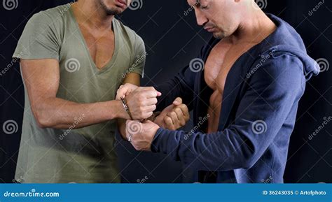 One Man Putting Handcuffs To Another Man Stock Image Image Of Arrest