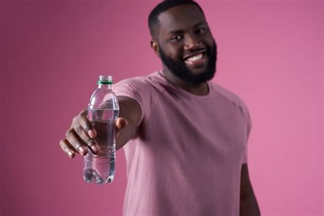 Premium Photo African Man Drinking Water