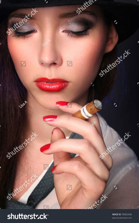 Beautiful Young Woman Smoking Cigar Stock Photo 78082606