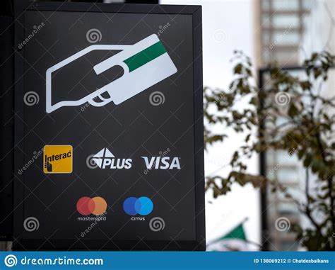 Sign On An Atm With The Logos Indicating The Credit And Debit Pay Cards