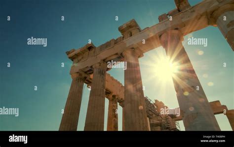Sun And Columns Of Parthenon At Acropolis In Athens Greece Stock Photo