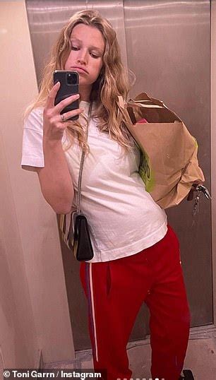 Pregnant Toni Garrn Displays Growing Baby Bump As She Packs On The Pda