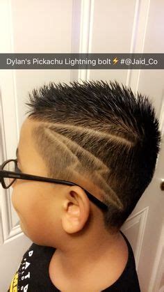This is one of the best haircut designs we've ever seen. Classic Mohawk type Burstie Fade with three lines and a ...