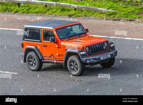 2019 Orange Jeep Wrangler Rubicon Auto Vehicular Traffic Moving