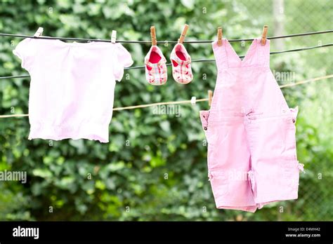 Baby Clothes Hanging On The Clothesline Stock Photo Alamy