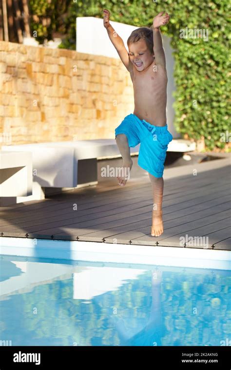 Whoopee An Excited Young Boy Jumping Into A Swimming Pool Stock Photo