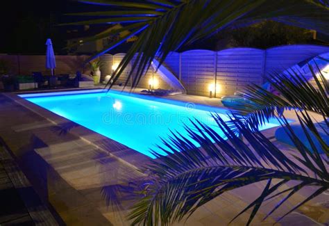 Water Of Swimming Pool Illuminated In Blue Stock Photo Image Of Blue