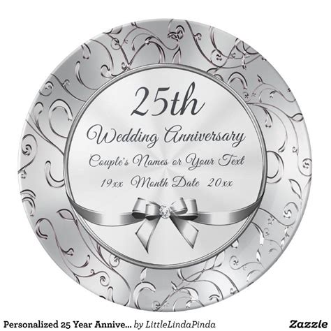 A 25th Wedding Anniversary Plate With A Bow And Ribbon On The Front In