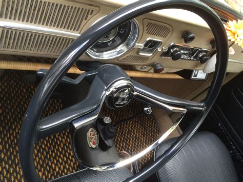 The Steering Wheel And Dashboard Of An Old Car