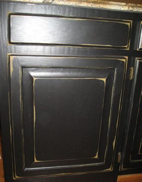 Once the base shade dries, use the motifs with distinctive hues. Distressed Black Cabinets | NeilTortorella.com
