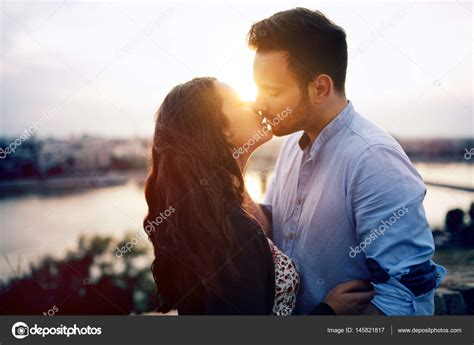 Couple Kissing During Sunset Stock Photo By ©nd3000 145821817