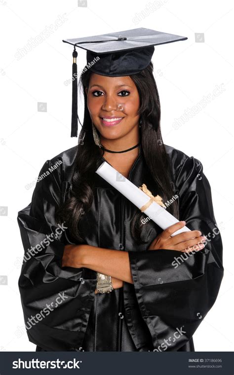 Young African American Graduate Dressed In Gown And Mortarboard Stock