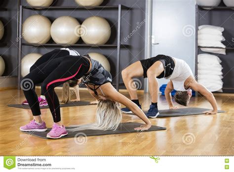 Friends Bending Backwards In Gym Stock Photo Image Of Activity