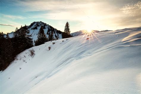 Sunrise Over Snowy Mountains Stock Photo By Catolla Photodune