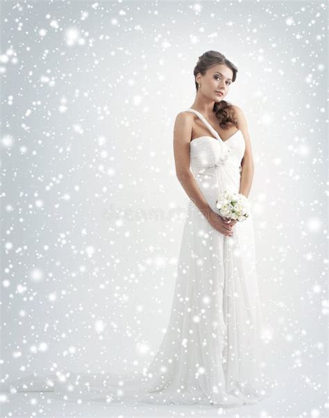 A Young Bride In A White Dress On A Snowy Bac Stock Photo Image Of