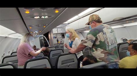 drunk frontier airlines passenger falls down and is kicked off flight youtube