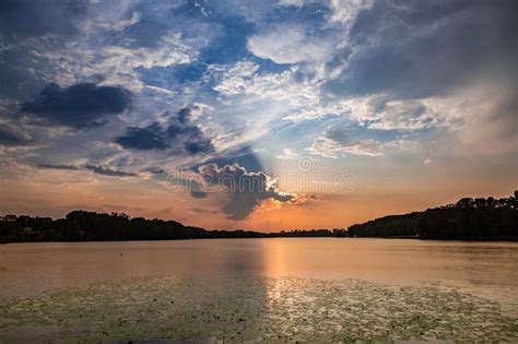 Stunning Sunset At The Summer Lake With Dynamic Clouds Stock Image