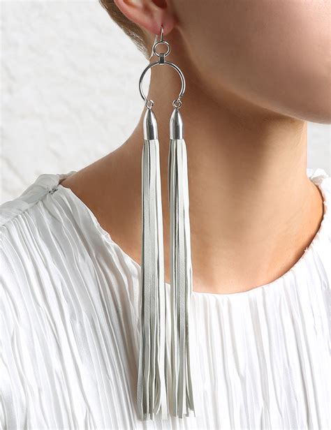 Wrap the small band around the top and either glue or stitch into place. Zimmermann Double Leather Tassel Earring in Metallic - Lyst