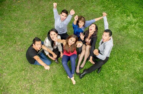 Group Of Friends Holding Hands Up Outdoors Stock Image Image Of
