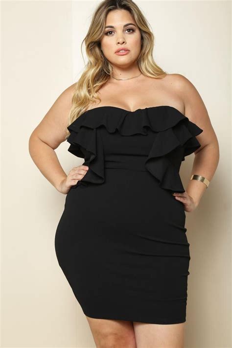 a glamorous plus size mini dress featuring a ruffled styling along the neckline and bodice that