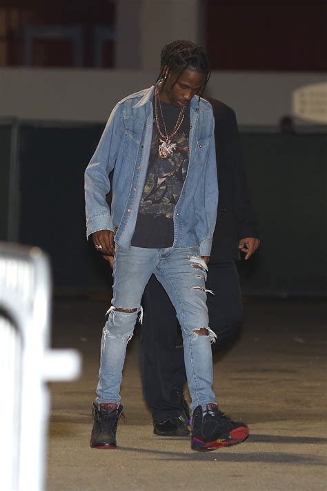 The wars led to fabric rationing and baggy clothes fell out of style in traditional menswear until the 1980's. Travis Scott's On-Tour Style: The Texas Tuxedo - Vogue
