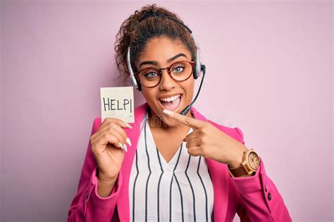 African American Call Center Agent Girl Using Headset Holding Reminder