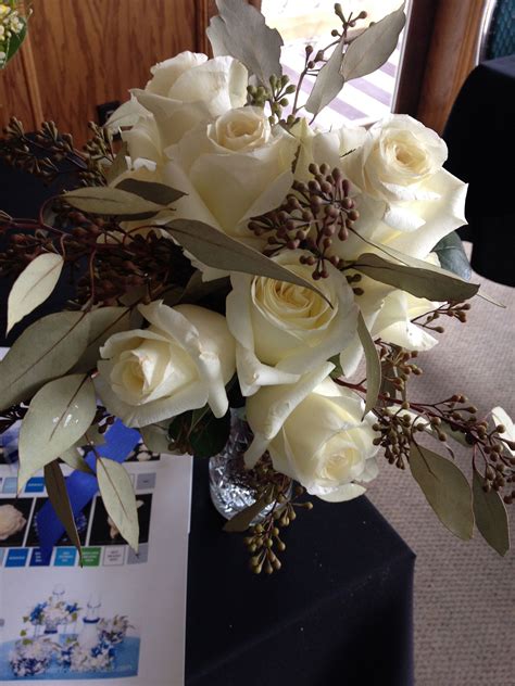 white rose hand tied bouquet with euc berries | Hand tied bouquet, Bridal bouquet, White roses