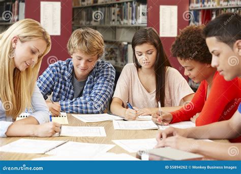Group Of Students Working Together In Library Stock Photo Image Of