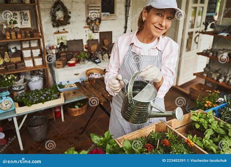 Jolly Female Enjoying Looking After Plants Indoors Stock Image Image