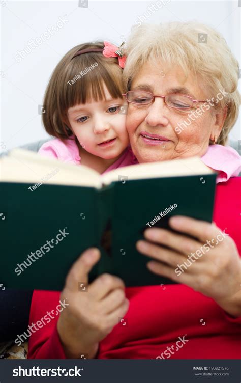 Grandmother Reading Book Her Granddaughter Stock Photo 180821576