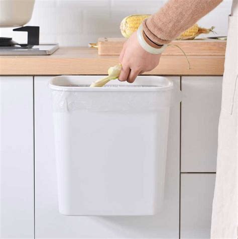 Outfit your kitchen cabinets with implements designed to make the most of your storage space. Easy Hanging Kitchen Cabinet Dustbin | Kitchen Trash Bin | Style Degree